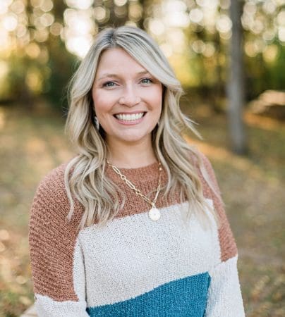 Photo of Brittney smiling outdoors.